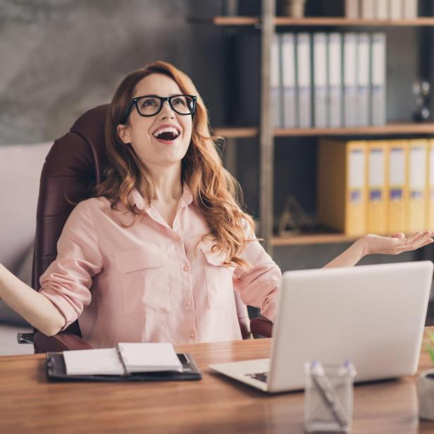 Close up photo beautiful she her business lady hand arm head raised up laugh laughter big salary income earnings genius startup notebook table sit office chair wearing specs formal-wear shirt