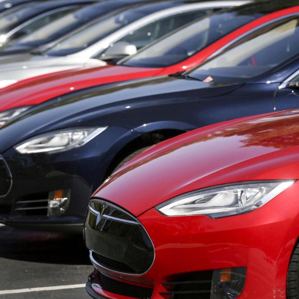 FILE PHOTO: FILE PHOTO: Row of Tesla Model S sedans are seen outside the company's headquarters in Palo Alto, California