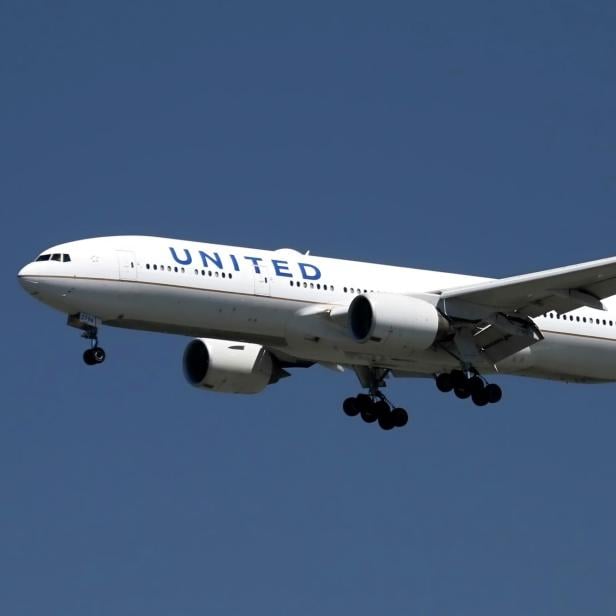 FILE PHOTO: A United Airlines Boeing 777 lands at San Francisco International Airport, San Francisco