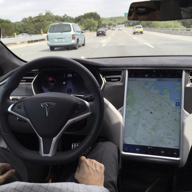 FILE PHOTO: The interior of a Tesla Model S is shown in autopilot mode in San Francisco