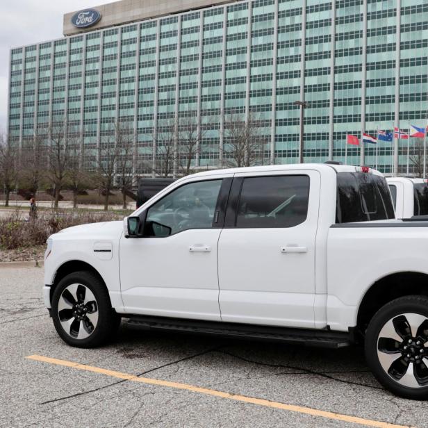 FILE PHOTO: A model of the all-new Ford F-150 Lightning electric pickup is parked in front of the Ford Motor Company World Headquarters in Dearborn