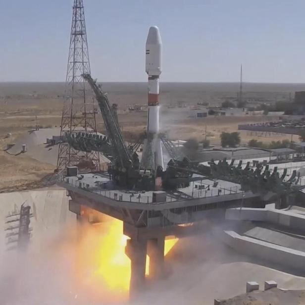 A Soyuz-2.1b rocket booster with the Iranian satellite "Khayyam" blasts off from the launchpad at the Baikonur Cosmodrome