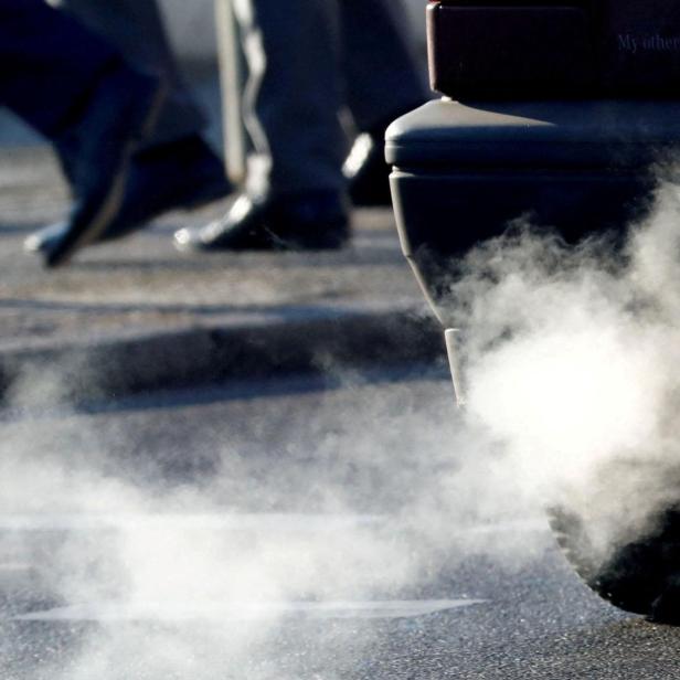 FILE PHOTO: An exhaust pipe of a car is pictured on a street in a Berlin