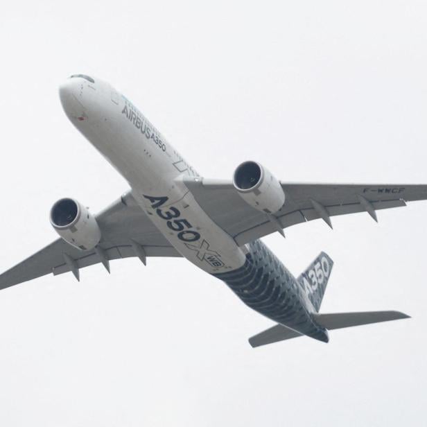 FILE PHOTO: A Airbus A350 aircraft during a display at the Farnborough International Airshow, in Farnborough