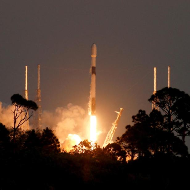 FILE PHOTO: A SpaceX Falcon 9 rocket lifts off with a payload of 21 Starlink satellites from the Cape Canaveral Space Force Station