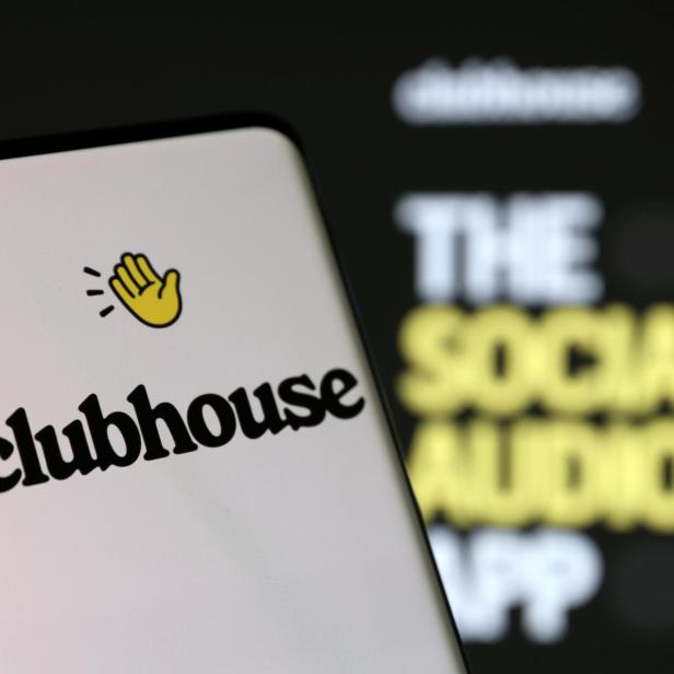 Illustration shows smartphone with Clubhouse's logo