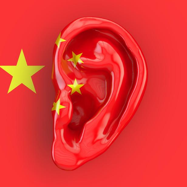 Chinese intelligence concept, ear on the flag of China. 3D rendering