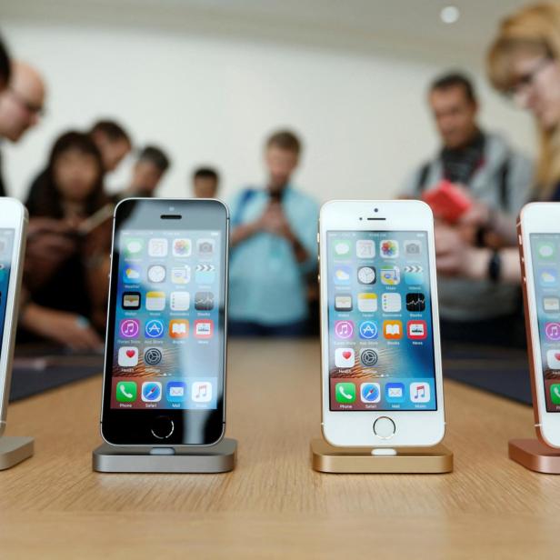 FILE PHOTO: The new iPhone SE is seen on display during an event at the Apple headquarters in Cupertino, California