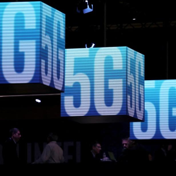 FILE PHOTO: Hanging cubes display 5G logo at the Mobile World Congress in Barcelona