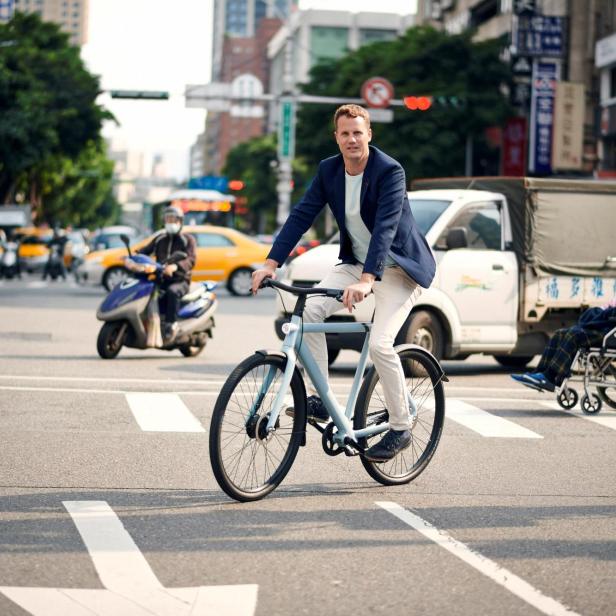 FILE PHOTO: Ties Carlier, co-founder of Dutch electric bike maker Vanmoof, rides a bike