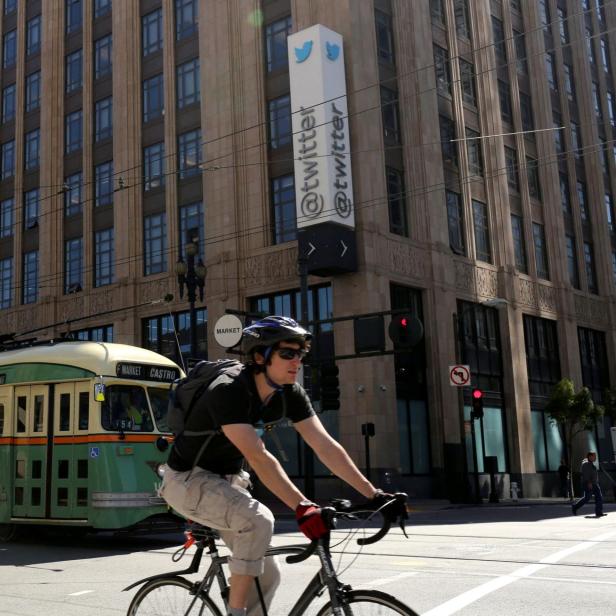 FILE PHOTO: A vintage streetcar passes in front of the Twitter headquarters on Market Street in San Francisco