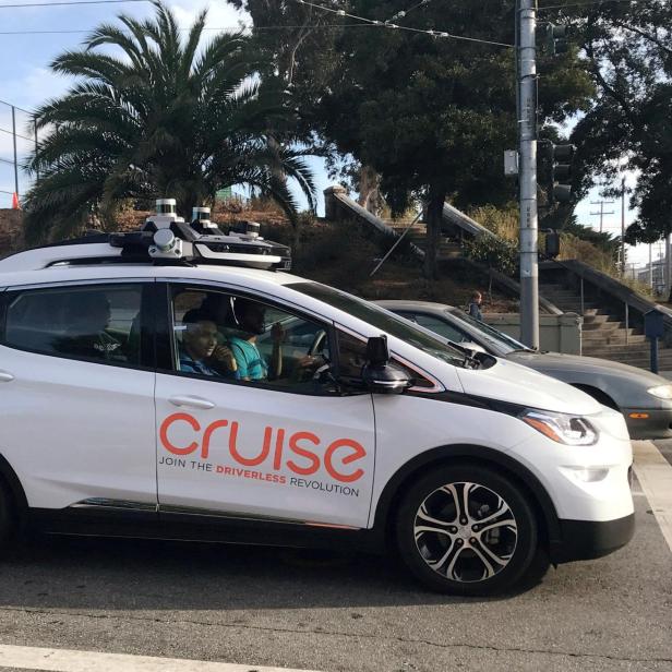 FILE PHOTO: A Cruise self-driving car, which is owned by General Motors Corp, is seen outside the companys headquarters in San Francisco