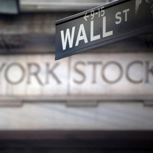 FILE PHOTO: A Wall Street sign outside the New York Stock Exchange