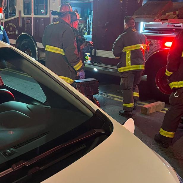 San Francisco firefighters attend the scene where pedestrian was struck by a Cruise robotaxi