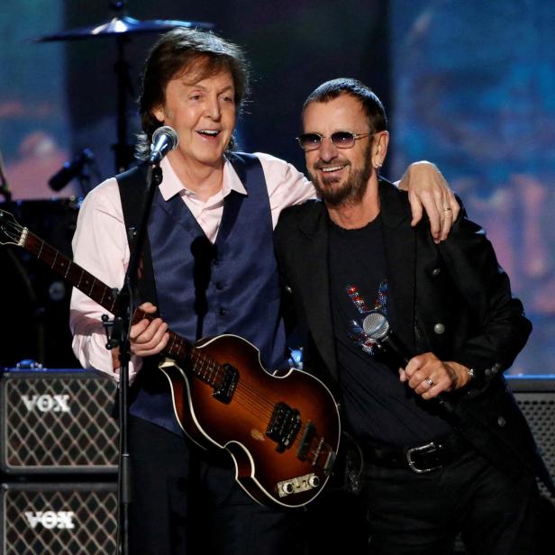 FILE PHOTO: Paul McCartney and Ringo Starr perform during the taping of "The Night That Changed America: A GRAMMY Salute To The Beatles"  in Los Angeles