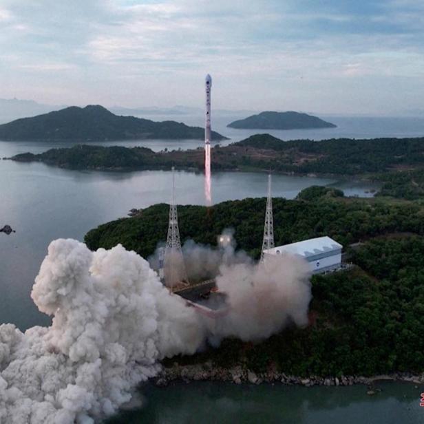 FILE PHOTO: A still photograph shows what appears to be North Korea's new Chollima-1 rocket being launched in Cholsan County