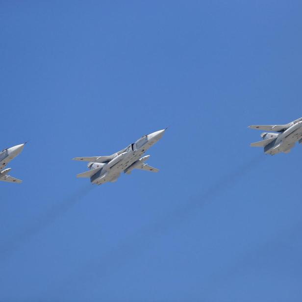 FILE PHOTO: Sukhoi Su-24 bombers fly in formation over the Red Square during the Victory Day parade in Moscow