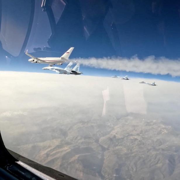 Russian Su-35S combat aircraft escort Russian President Putin's plane heading to United Arab Emirates