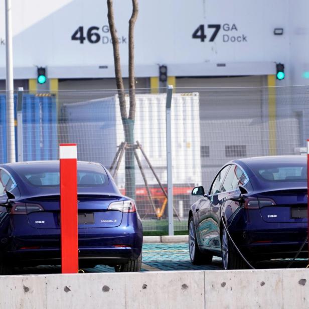 FILE PHOTO: China-made Tesla Model 3 electric vehicles are seen at the Gigafactory of electric carmaker Tesla Inc in Shanghai