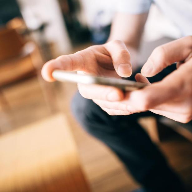 male hands using smartphone