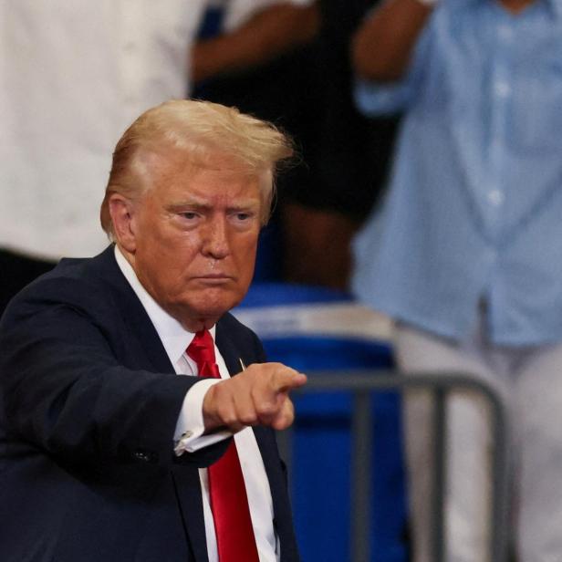 FILE PHOTO: Republican presidential nominee and former U.S. President Donald Trump and his running mate JD Vance hold a campaign rally in Atlanta, Georgia