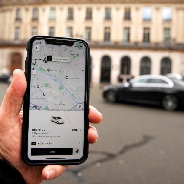 FILE PHOTO: A photo Illustration shows the Uber application on a mobile phone in in central Paris