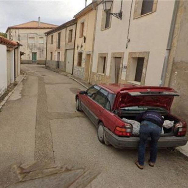 A Google Street View picture shows a man placing what appears to be a bag with a body in a car's trunk, in Tajueco