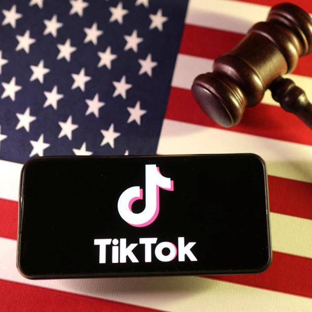 Illustration shows U.S., Chinese flags, TikTok logo and gavel