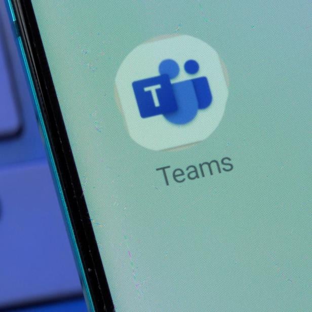 Microsoft Teams app is seen on the smartphone placed on the keyboard in this illustration taken