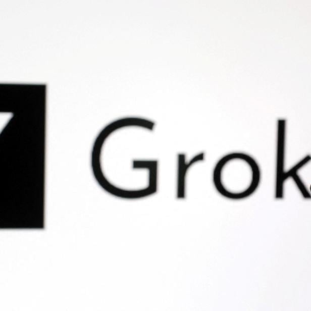 Illustration shows 3D-printed miniature model of Elon Musk and Grok logo