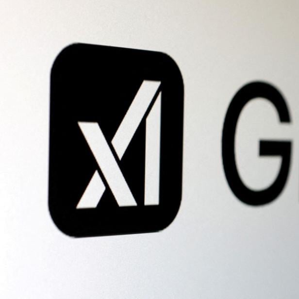 FILE PHOTO: Illustration shows xAI and Grok logos