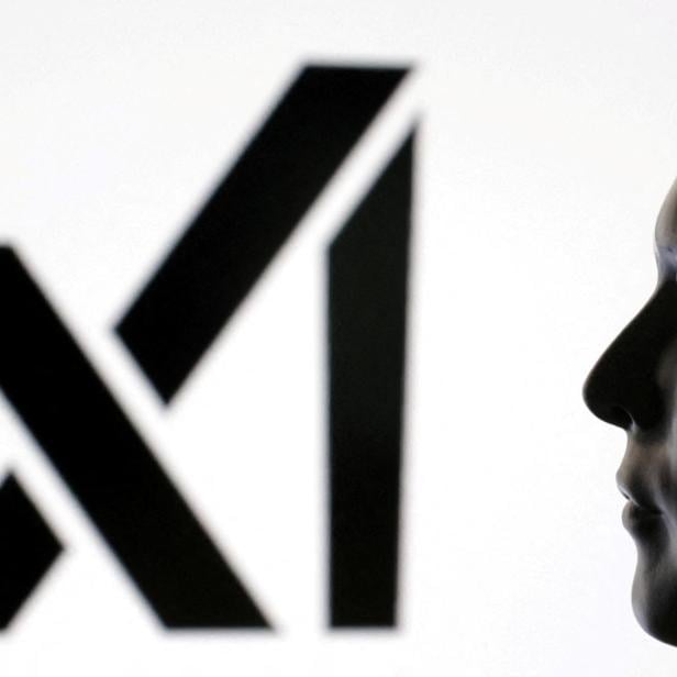FILE PHOTO: Illustration shows 3D-printed miniature model of Elon Musk and xAI logo