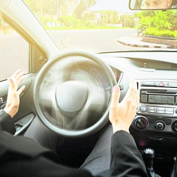 Man Sitting On Self Drive Car Seat