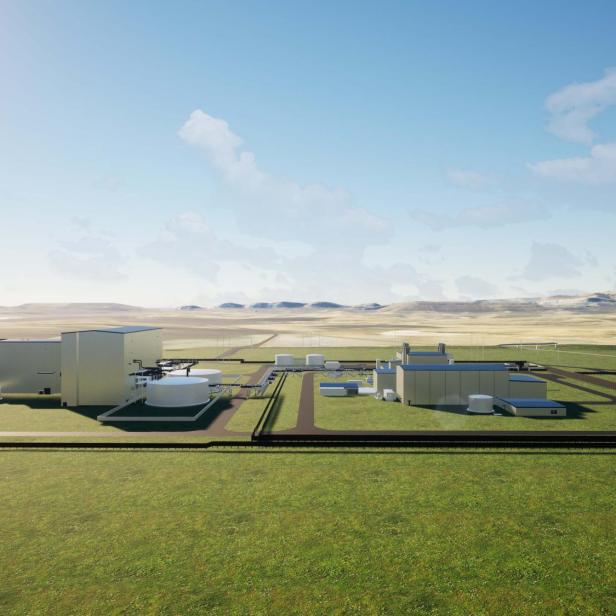 Visualisierung eines modernen Kernkraftwerks mit mehreren Gebäuden in einer weiten Landschaft.