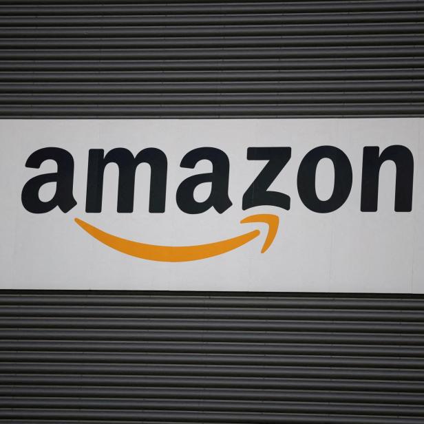 FILE PHOTO: Amazon logo outside an Amazon warehouse in Manchester